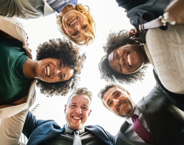 Group of people huddled in a circle