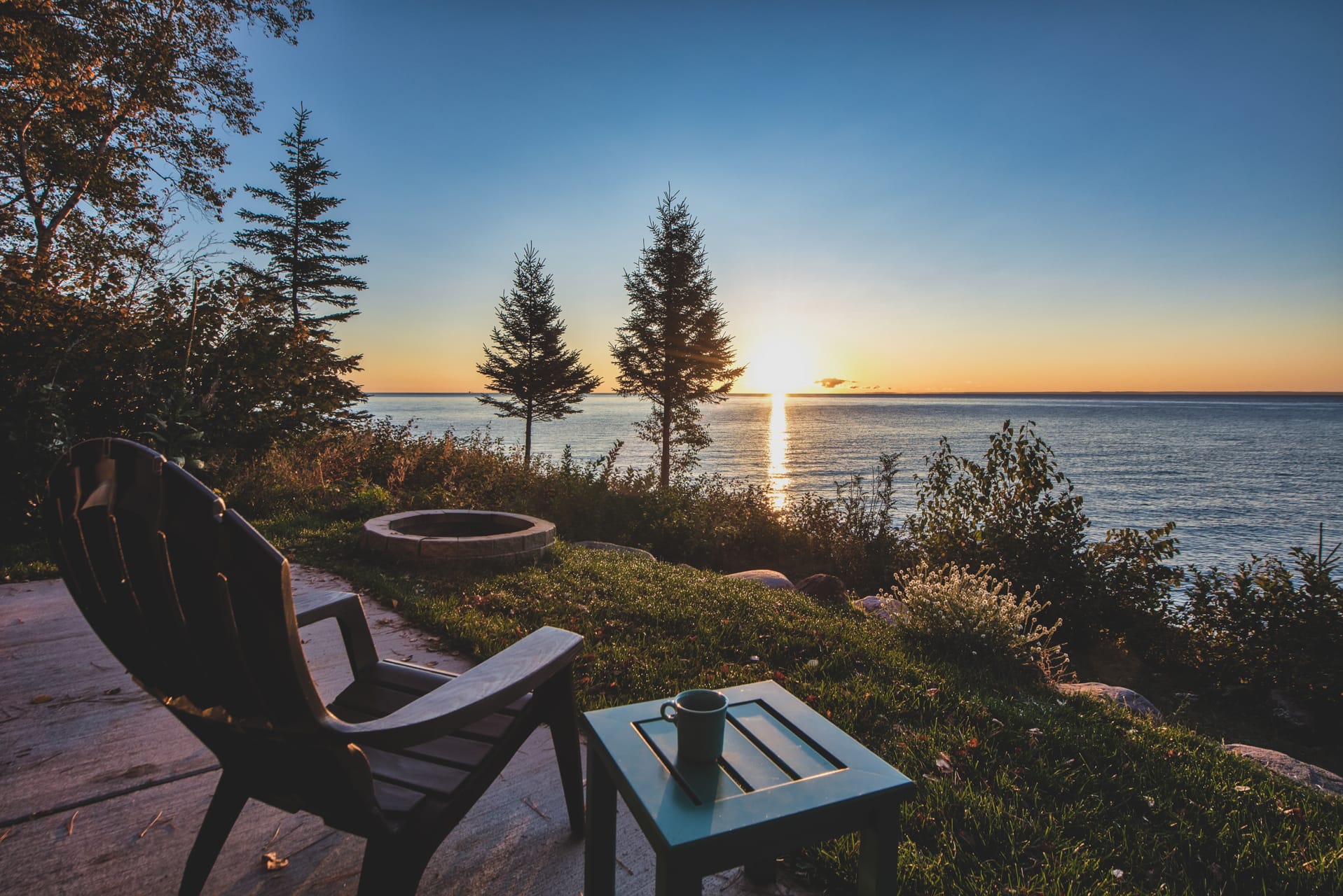 Adirondack style chair overlooking a beautiful sunset view