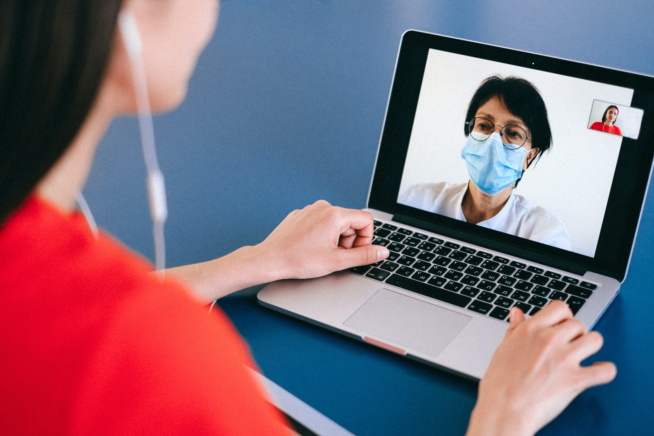 a women in a virtual meeting on her computer