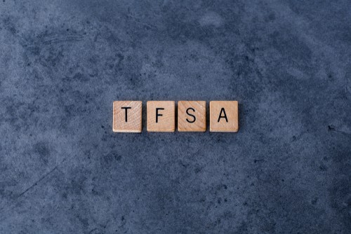 4 scrabble pieces on a table containing the letters TFSA